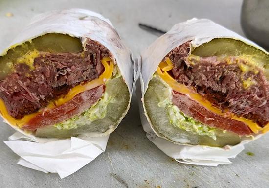 Assorted bagels and toppings being prepared